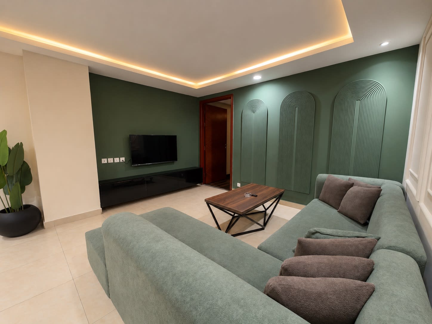 Lounge seating against green and white panelled walls